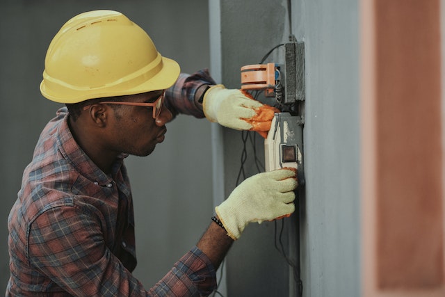 a-person-inspecting-a-fuse-box